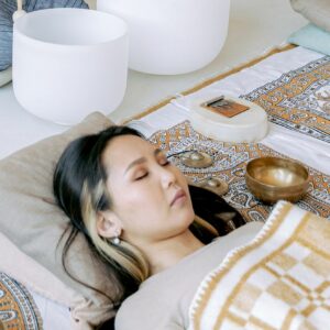 Calming sound bath session with singing bowls for relaxation and wellness.
